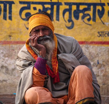 Varanasi, India - Dec 23, 2019: Sadhu at the ghats in Varanasi in India