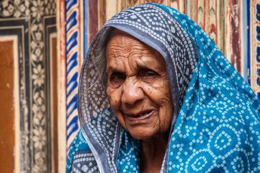 Nawalgarh, India - Dec 28, 2019: Women in traditional sari in front of a haveli