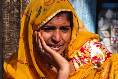 Jaisalmer, India - Dec 31, 2019: Rajasthani gypsy woman in traditional attire