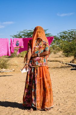 Jaisalmer, India - Jan 01, 2020: Rajasthani gypsy woman in traditional attire