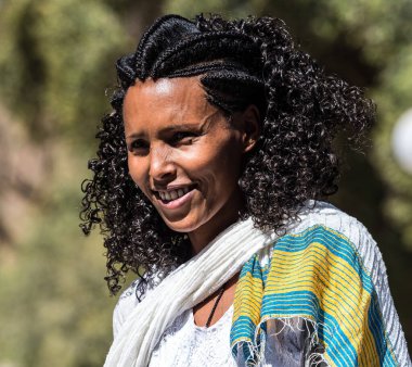 Aksum, Ethiopia - Feb 09, 2020: Ethiopian woman at Church of Our Lady St. Mary of Zion, the most sacred place for all Orthodox Ethiopians in Axum, Ethiopia. clipart