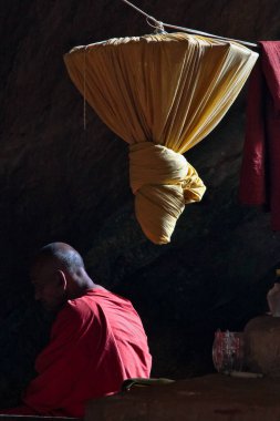 Hpa-an, Myanmar - Nov 06, 2019: Monk inside of Kaw Ka Thaung Cave, located close to Hpa-An, Myanmar