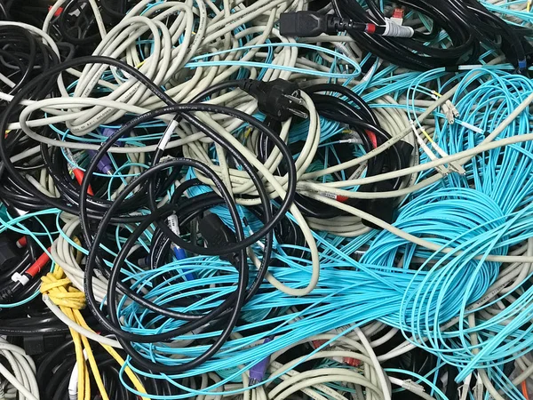 Old network cables and power cables in a pile for disposal — Stock Photo, Image