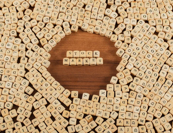 Stock Market Letters cubes on a wooden board — Stock Photo, Image