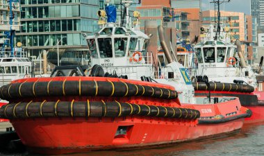 Hamburg, Germany  April 02, 2017: Tugging on the same to haul a container ship on April 02, 2017, in the Germany Hamburg clipart