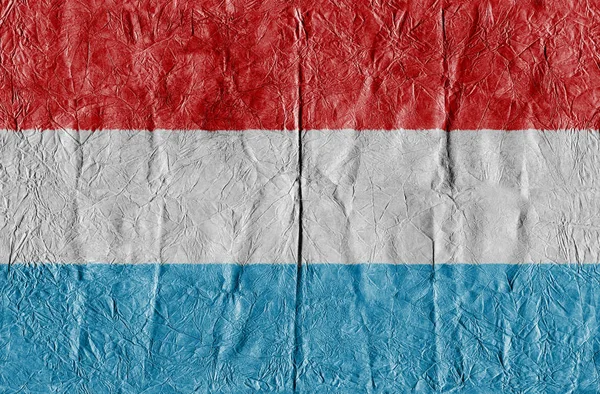 Luxembourg flag on a paper in close-up — Stock Photo, Image