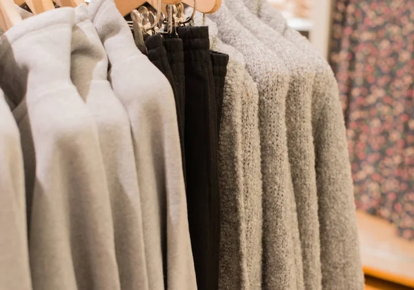 Cardigan on a clothes rack for winter closing — Stock Photo, Image