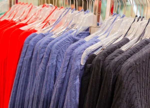 Colorful cashmere sweater on a clothes rack — Stock Photo, Image