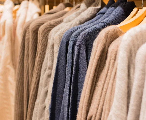 Colorful cashmere sweater on a clothes rack — Stock Photo, Image