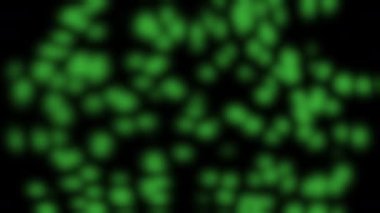 Siyah arkaplan üzerinde parlayan parçacıkların rastgele hareketi.