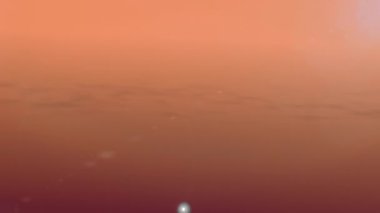 Uçak silueti usulca hareket ediyor ilahi güzellikte güneşli bulutlar arasında.