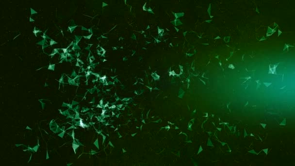 Close-up van groene deeltjes die chaotisch bewegen op de donkergroene stralende achtergrond. — Stockvideo