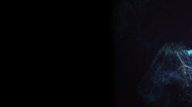 Mavi toz siyah arkaplanda sıçrıyor.