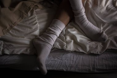 women's feet in white stockings white socks on the bed style background screensaver picture decor nostalgia romance picture for classical music