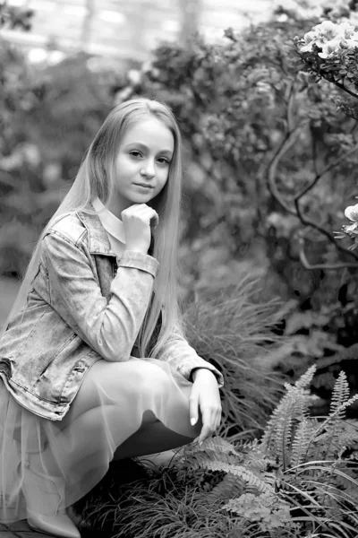 Young girl with long white hair in a hat and a denim jacket walk — 스톡 사진