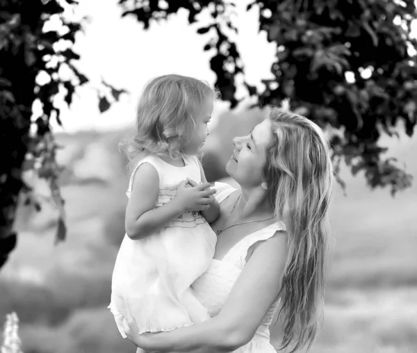 Mom and little daughter have fun and walk in the lavender field — Stock Photo, Image