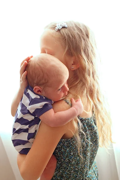 Loving Older Sister Blonde Sweetheart Touching Gentle Holds Her Newborn — Stock Photo, Image