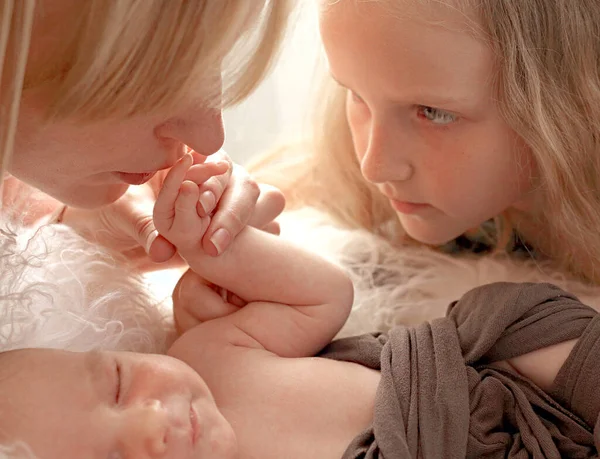 Loving Mom Older Sister Hold Handle Newborn Boy Kiss Cute — Stock Photo, Image