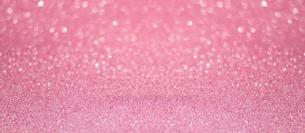 beautiful pink sequins on the glitter sparkle of sun light backg
