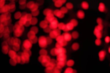 Yuvarlak şekilli kırmızı ışık desenli duvar kâğıdı siyah arkaplanda bokeh