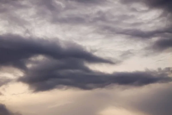 Dramatic sunset sky with clouds in windy summer day