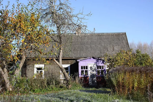 autumn landscape with a house with a backyard