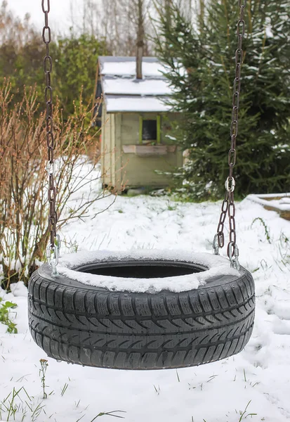 winter landscape with tire swing