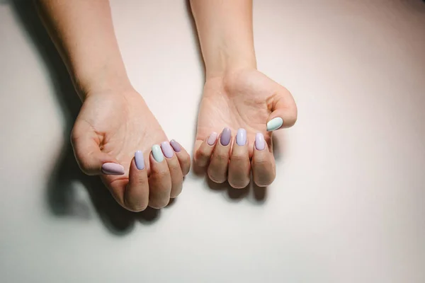 Woman with flesh-colored manicure with design, close up — Stock Photo, Image