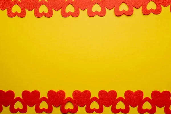 Red paper hearts on yellow background, copy space — 스톡 사진