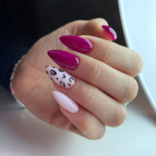 Woman with flesh-colored manicure with design. Fresh-colored female manicure on nails