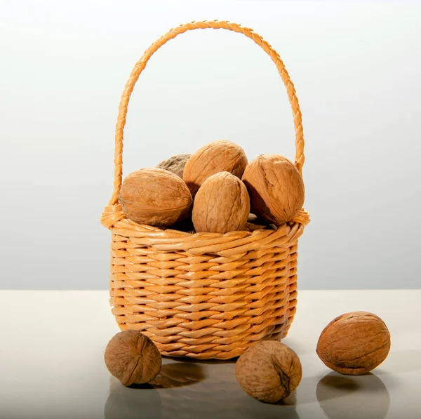 Ripe Fresh Walnuts Wicker Basket Three Nuts White Background Harvest — Φωτογραφία Αρχείου