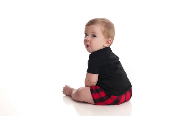 Baby pojke tittar över axeln — Stockfoto