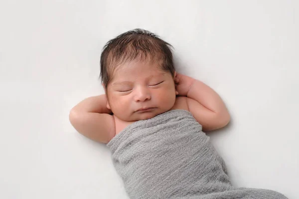 Newborn Baby Boy Swaddled in Gray Wrap — Stock Photo, Image