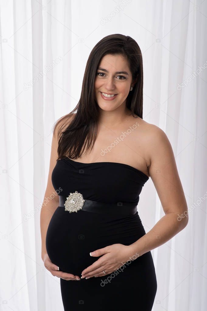 Smiling Pregnant Woman in a Black Gown