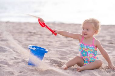 One Year Old Girl Playing in the Sand clipart