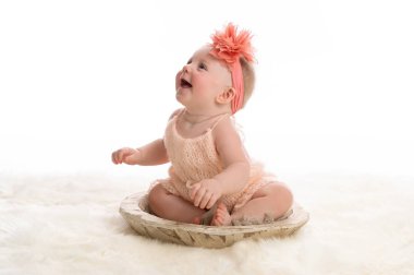 Baby Girl Sitting in a Wooden Bowl clipart
