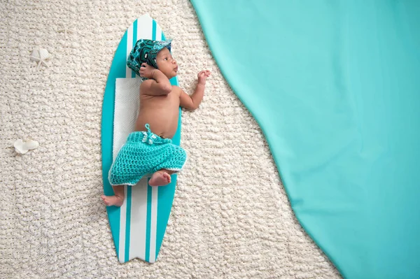 Newborn Baby Boy on Surfboard — Stock Photo, Image