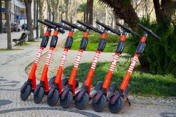 Lisbon, Portugal. Red Uber Jump electric scooters for rent — Stock Photo, Image