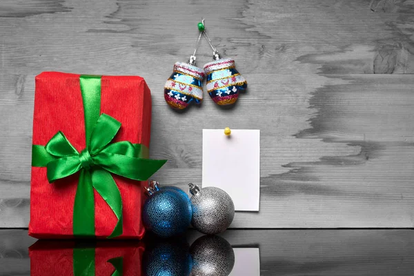 Christmas box with a gift and a sticker — Stock Photo, Image