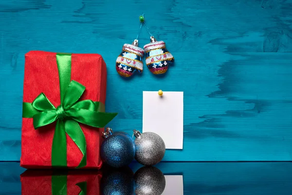 Christmas box with a gift and a sticker — Stock Photo, Image