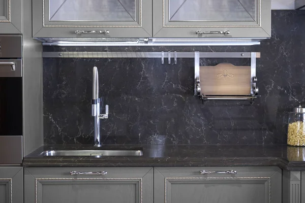 Stainless steel sink and faucet in kitchen room — Stock Photo, Image