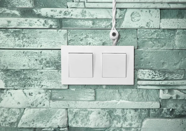 Wires and a switch on a stone wall — Stock Photo, Image