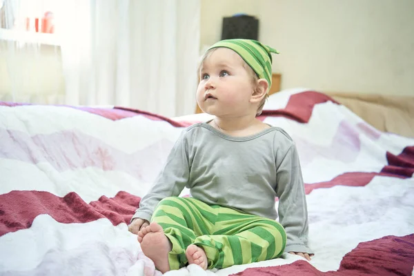 Happy baby lying on his stomach — Stock Photo, Image