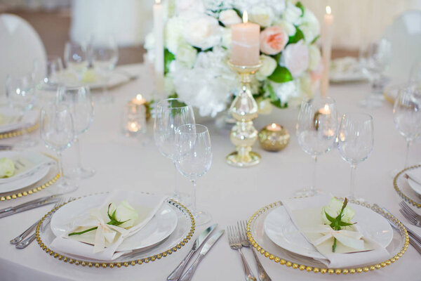 Beautiful table setting with white flowers