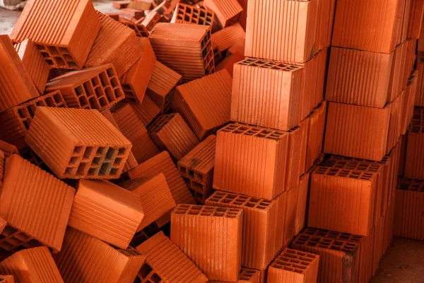 Buildings on the construction site stacked on the square red brick — Stock Photo, Image