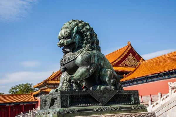 Beijing Palace Museum Taihe Temple in front of a pair of copper lions