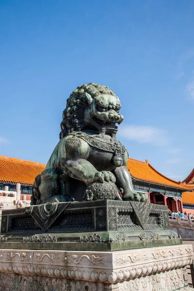 Beijing Palace Museum Taihe Temple in front of a pair of copper lions