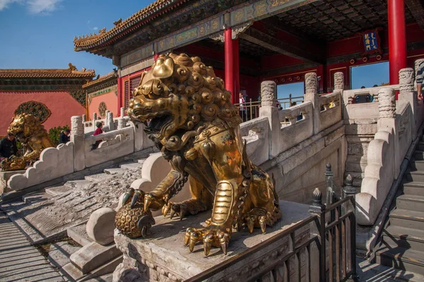 Beijing Palace Museum unloading garden in front of a pair of copper lions