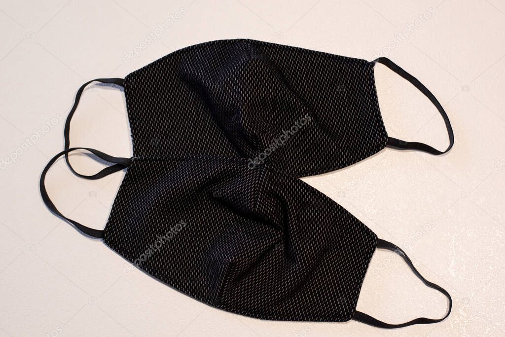 Handmade black face mask. Fabric black masks on a white background. Virus Protection