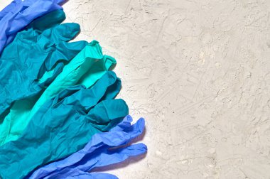 Tıbbi eldiven ve dokulu arka plan..